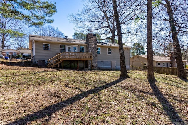 back of property with a chimney, stairs, fence, a wooden deck, and central air condition unit