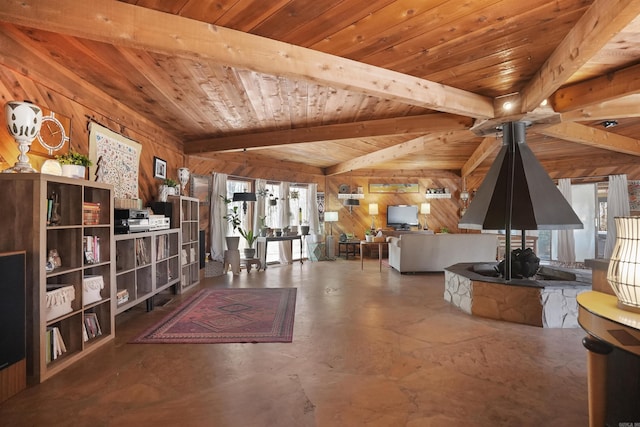 unfurnished room with wood walls, wooden ceiling, and beam ceiling