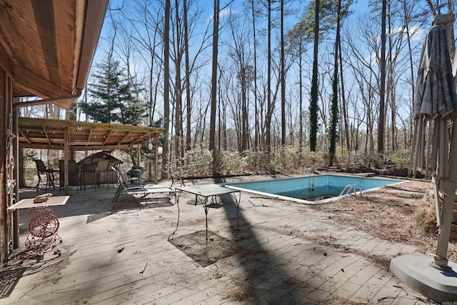 pool with a wooden deck