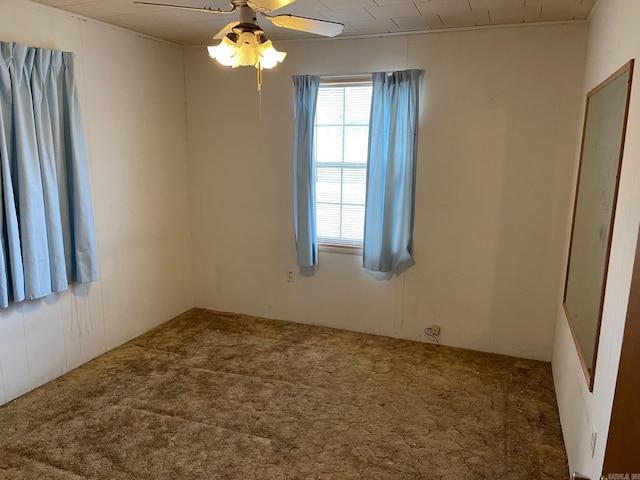 empty room with carpet flooring and ceiling fan