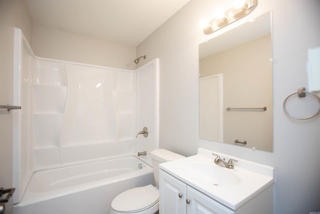 full bath with bathtub / shower combination, vanity, and toilet