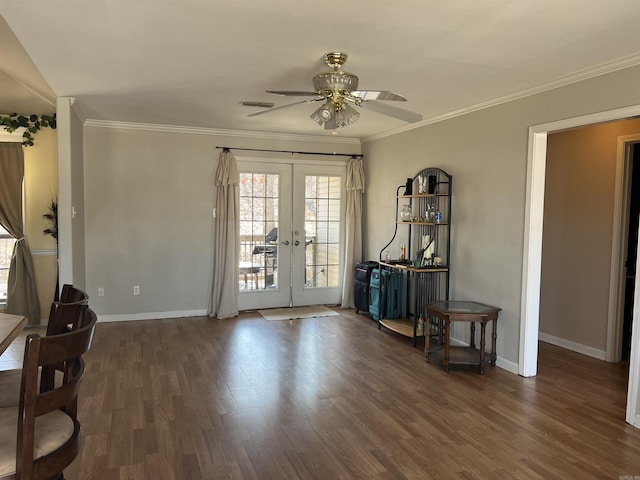 interior space with french doors, visible vents, ornamental molding, wood finished floors, and baseboards