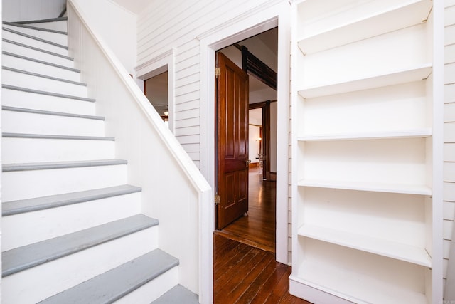 staircase featuring hardwood / wood-style flooring