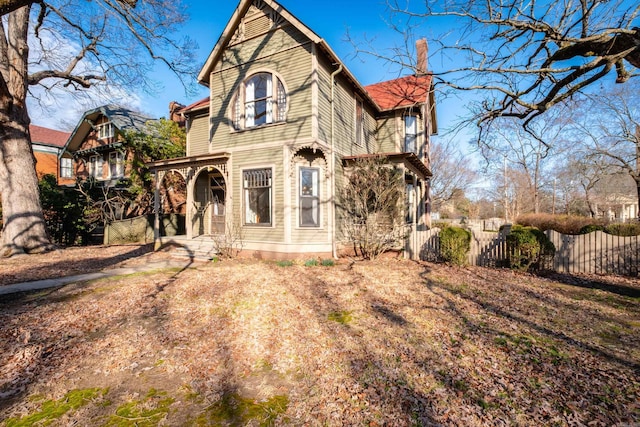 back of property featuring fence