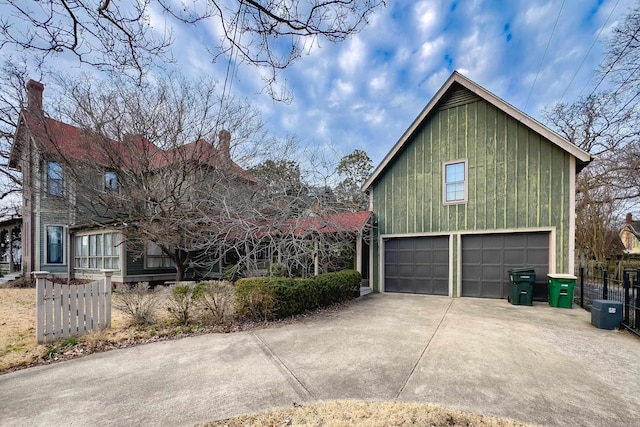 view of side of home with fence