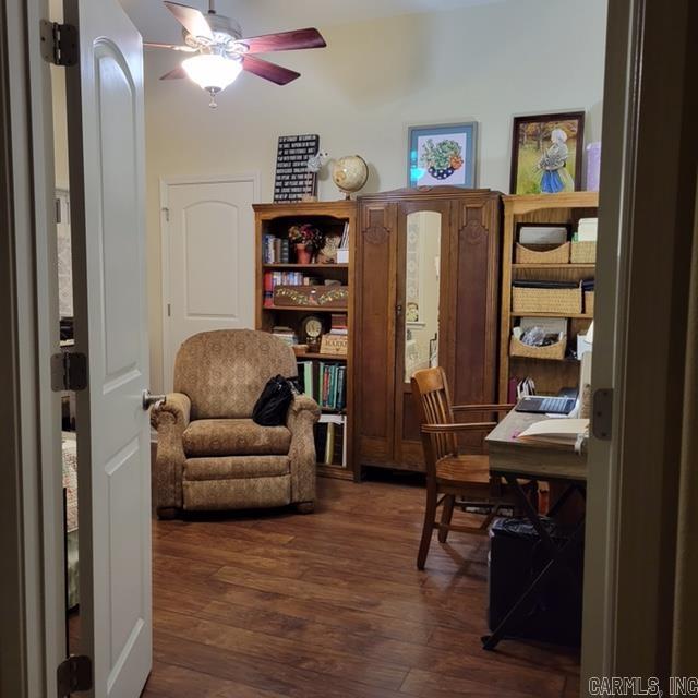 office space with dark wood-style floors and a ceiling fan