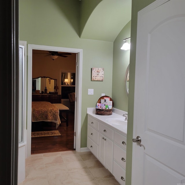 ensuite bathroom featuring ensuite bathroom, ceiling fan, vanity, and tile patterned floors