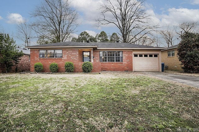 ranch-style house with a garage, driveway, brick siding, and a front lawn