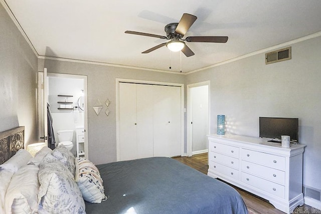 bedroom featuring connected bathroom, wood finished floors, visible vents, and crown molding