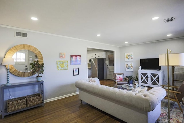 living room featuring ornamental molding, recessed lighting, visible vents, and wood finished floors