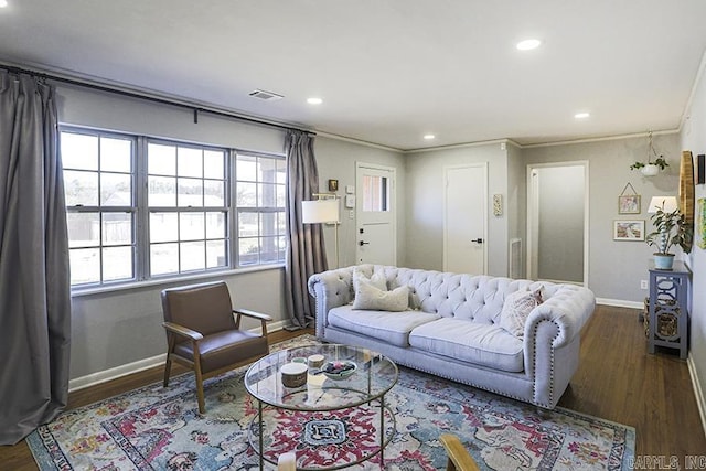 living area with visible vents, wood finished floors, and recessed lighting