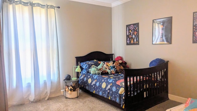 carpeted bedroom with baseboards and ornamental molding