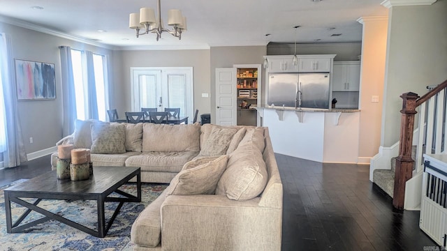 living area with crown molding, dark wood finished floors, stairway, and baseboards