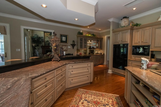 kitchen featuring black appliances, ornamental molding, wood finished floors, and recessed lighting