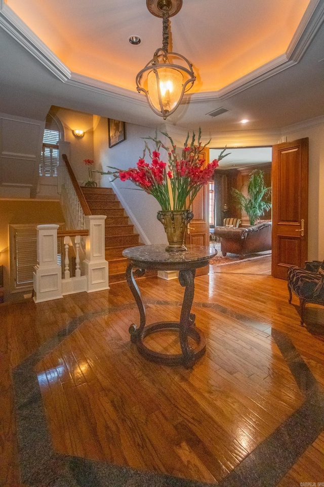 building lobby featuring visible vents and stairway