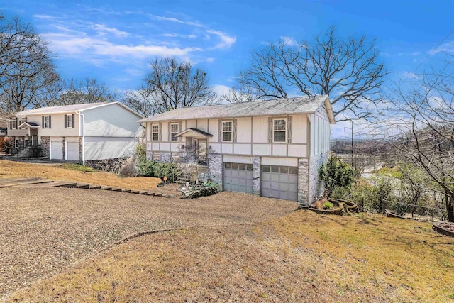 bi-level home with a garage and driveway