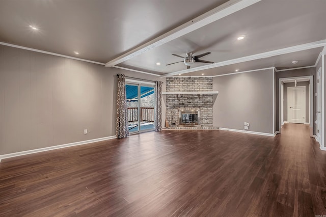 unfurnished living room with a brick fireplace, beam ceiling, dark wood-style floors, and a ceiling fan