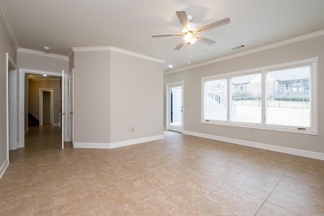 empty room featuring ornamental molding, visible vents, ceiling fan, and baseboards