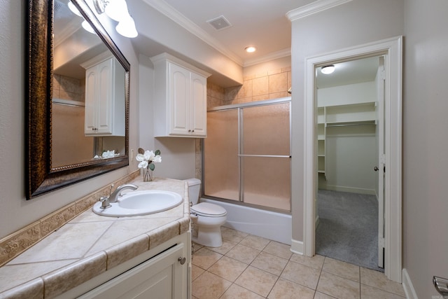 bathroom with visible vents, toilet, tile patterned flooring, crown molding, and vanity