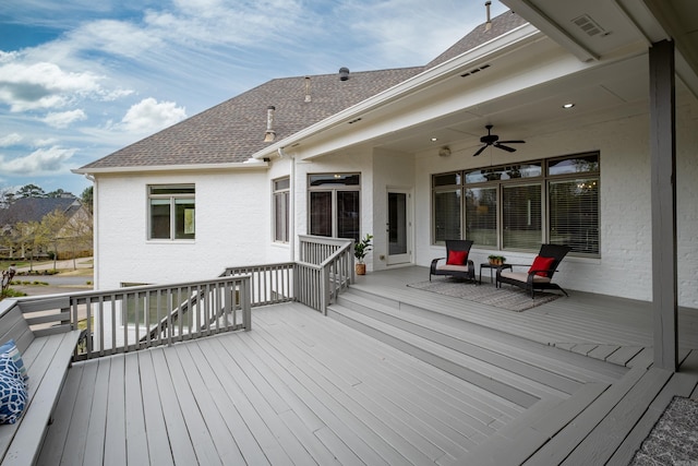 wooden deck featuring ceiling fan