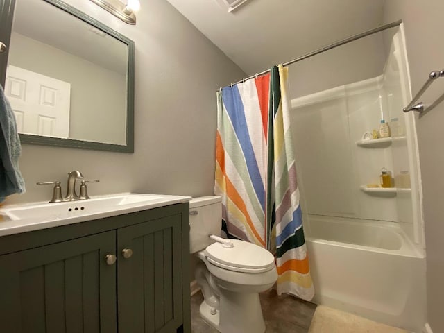 full bathroom with shower / bath combo, vanity, toilet, and tile patterned floors