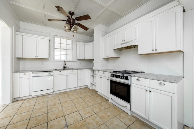 kitchen featuring white dishwasher, under cabinet range hood, a sink, backsplash, and range with gas cooktop