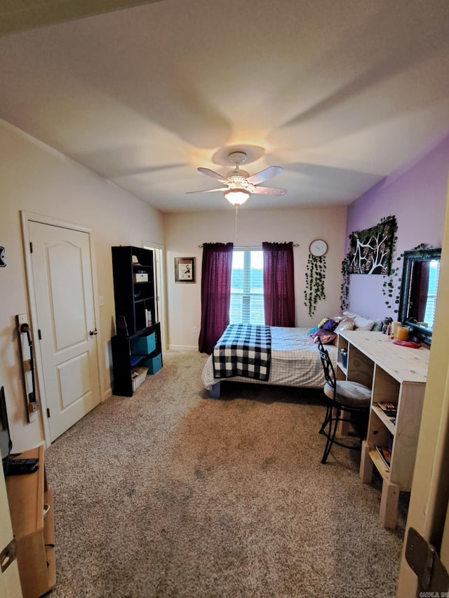 carpeted bedroom featuring ceiling fan