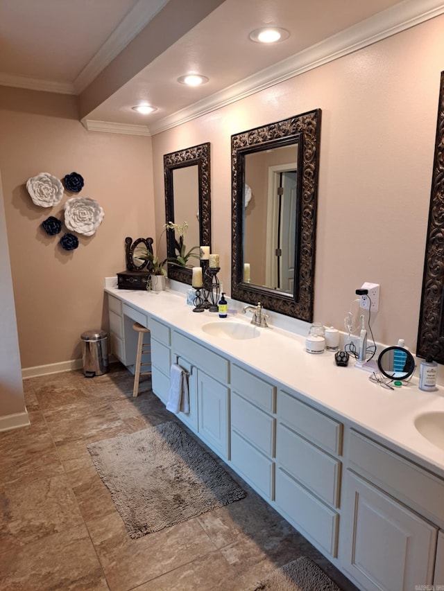 bathroom featuring recessed lighting, baseboards, ornamental molding, and vanity