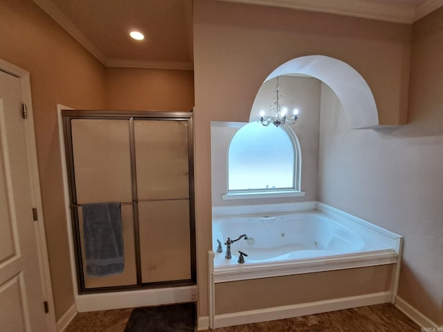 full bathroom featuring baseboards, ornamental molding, a shower stall, a whirlpool tub, and an inviting chandelier