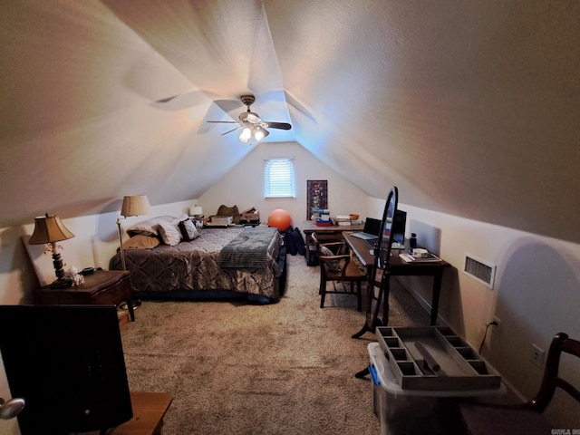 carpeted bedroom with lofted ceiling, visible vents, and a ceiling fan