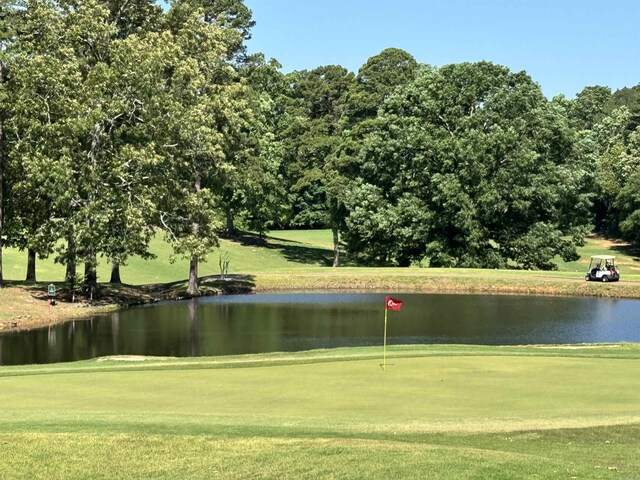 127 Emperado Way, Hot Springs Village, AR 71909 - surrounding community featuring a water view, a lawn, view of golf course, and an area to practice putting