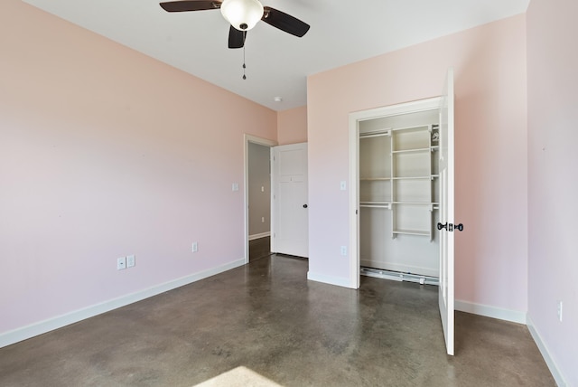 unfurnished bedroom featuring a closet, ceiling fan, finished concrete flooring, and baseboards