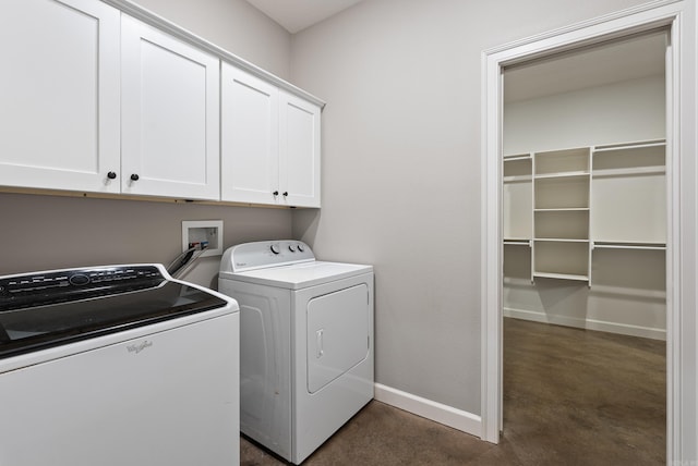 laundry room with washing machine and dryer, cabinet space, and baseboards