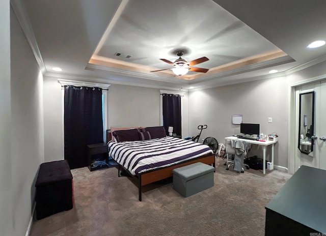 bedroom with visible vents, ornamental molding, a raised ceiling, and carpet floors