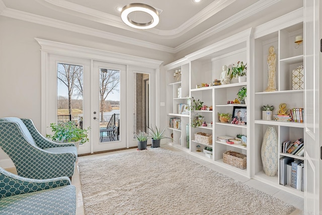 sitting room featuring french doors, tile patterned flooring, and crown molding