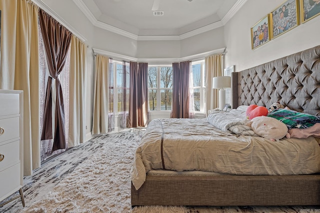 bedroom featuring ornamental molding and visible vents