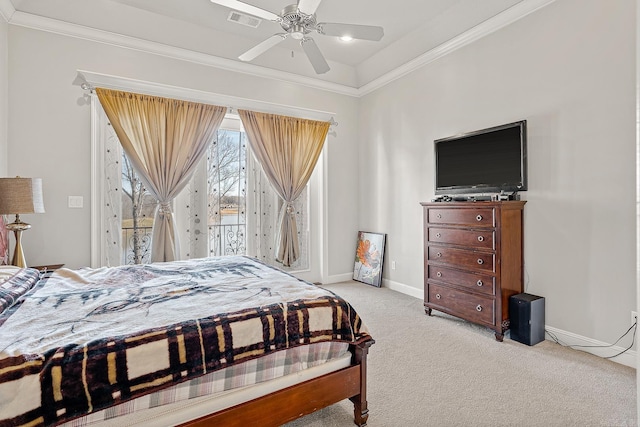 carpeted bedroom featuring baseboards, visible vents, ceiling fan, and crown molding