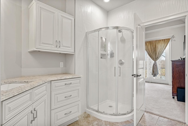 full bath featuring a stall shower and vanity