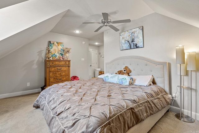 carpeted bedroom featuring vaulted ceiling, baseboards, and ceiling fan