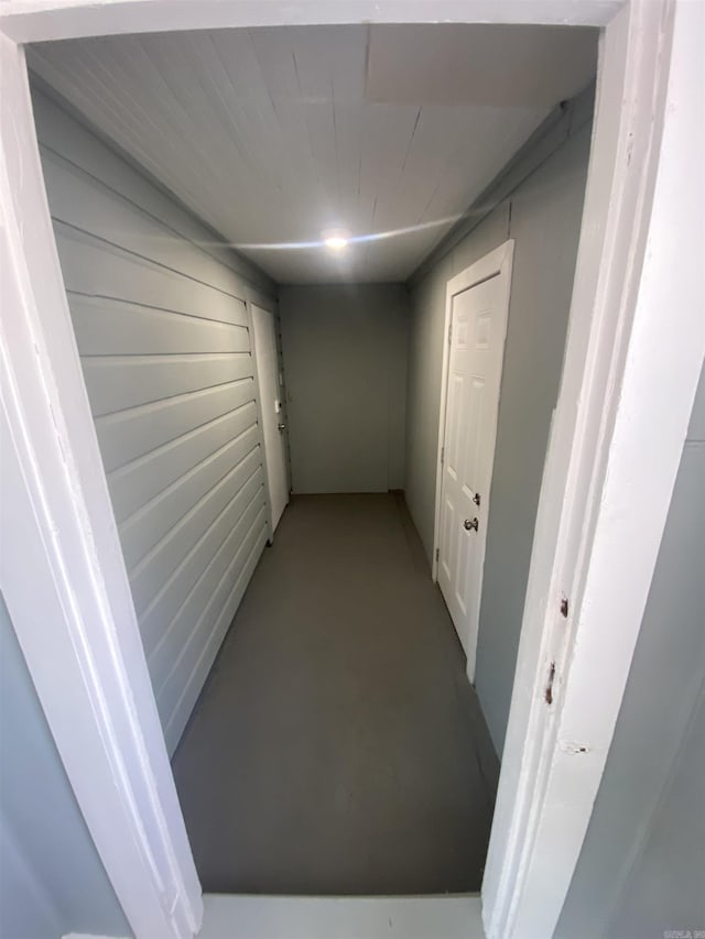 hallway with concrete floors