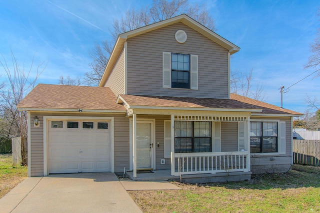 traditional home featuring a garage, a porch, roof with shingles, and fence