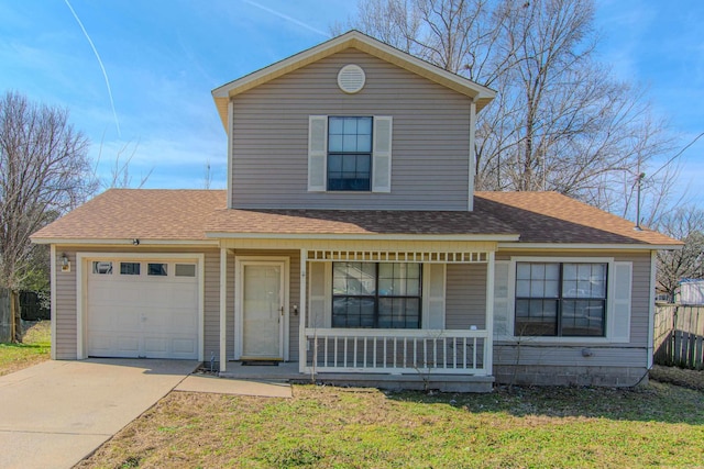 traditional-style house featuring a shingled roof, covered porch, an attached garage, and concrete driveway