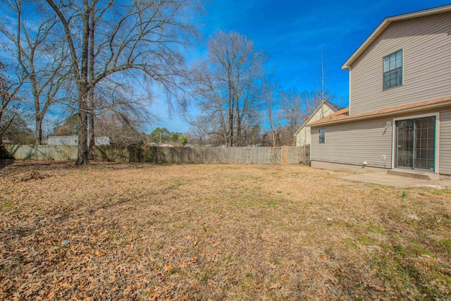 view of yard featuring a fenced backyard and a patio