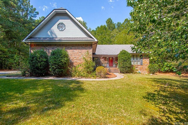 view of front of house with brick siding and a front yard