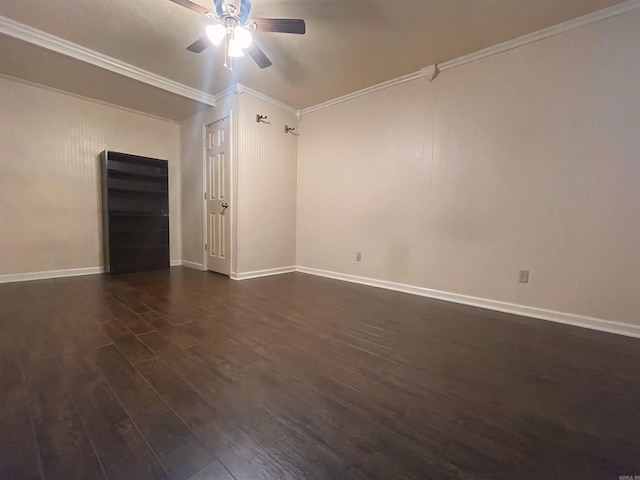 unfurnished room with crown molding, baseboards, ceiling fan, and dark wood-style flooring