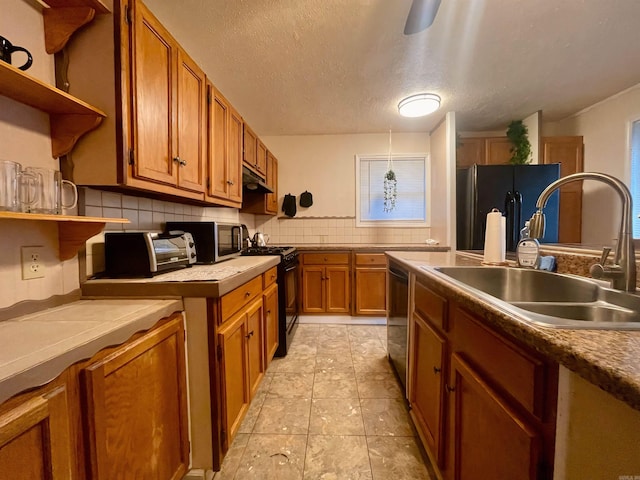 kitchen with open shelves, a sink, black appliances, tasteful backsplash, and brown cabinetry