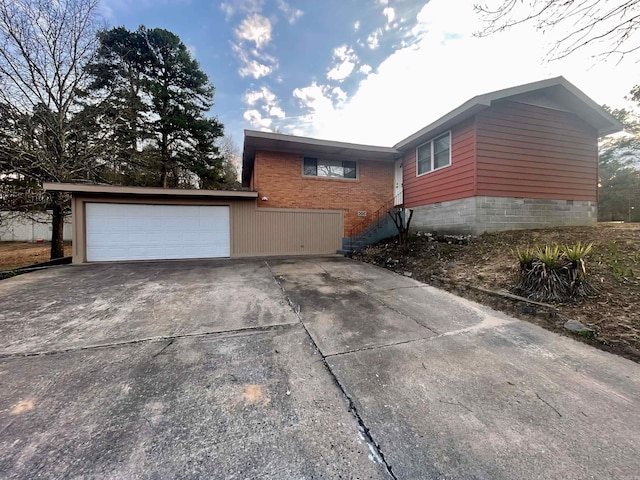 view of home's exterior with a garage and crawl space