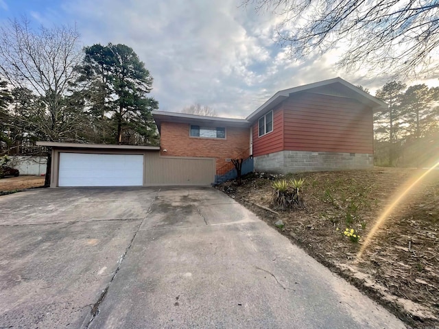 view of home's exterior featuring a garage and crawl space