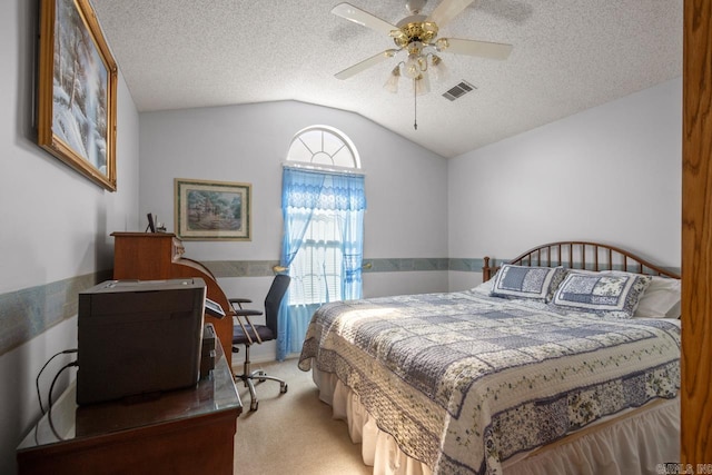 carpeted bedroom with lofted ceiling, a ceiling fan, visible vents, and a textured ceiling