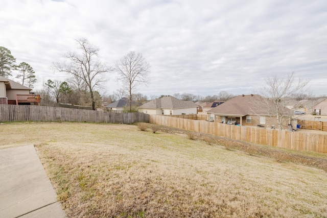 view of yard with fence private yard and a residential view